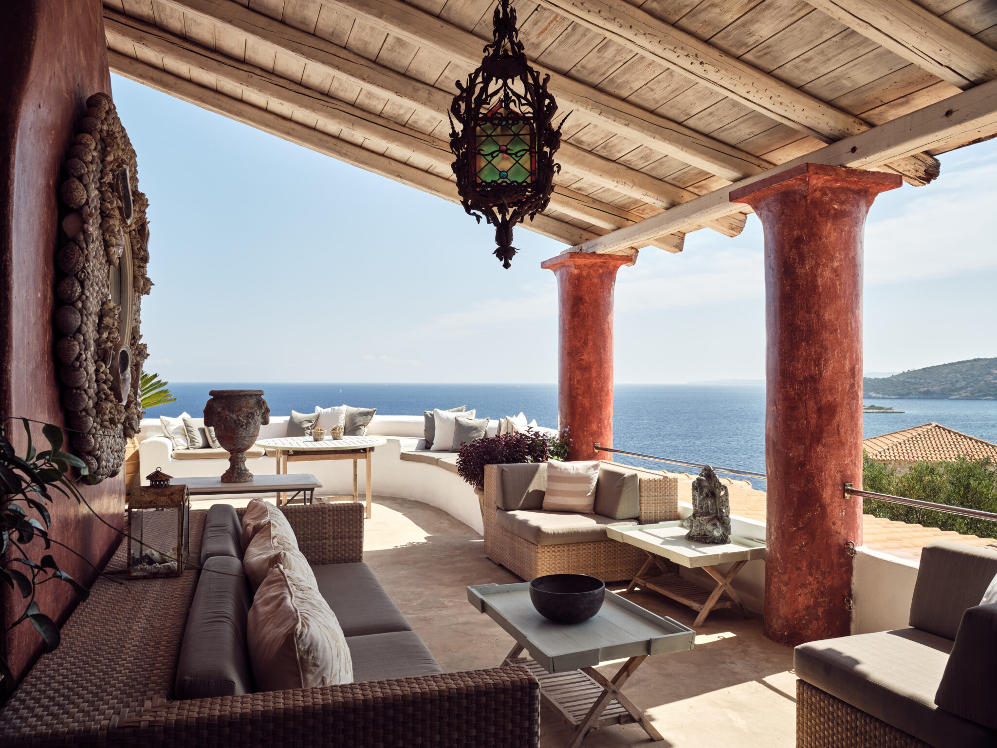 An opulent Italian style red villa with sea views